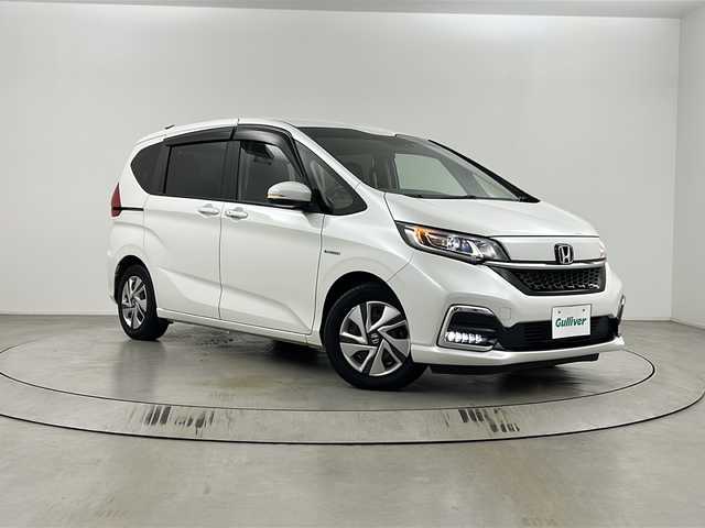 ホンダ フリード ハイブリット G ホンダセンシング 埼玉県 2021(令3)年 2.1万km プラチナホワイトパール 純正ナビ/バックカメラ　/ビルトインＥＴＣ　/両側電動スライドドア　/ＥＣＯＮ　/前後ドライブレコーダー　/シートヒーター　/純正フロアマット　/ウインカーミラー　/ドアバイザー　/ＬＥＤヘッドライト　/フォグランプ　/スマートキー/プッシュスタート