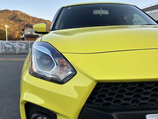 スズキ スイフト スポーツ 山梨県 2018(平30)年 7万km チャンピオンイエロー 6速MT/社外ナビ/バックカメラ/フルセグTV/CD/DVD/BT/ETC/純正17インチアルミホイール/ステアリングリモコン/クルーズコントロール/スマートキー/スペアキー1本/運転席シートヒーター/純正フロアマット