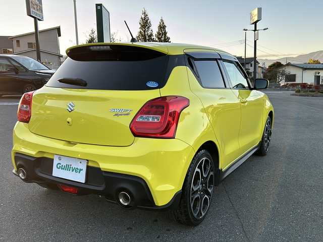スズキ スイフト スポーツ 山梨県 2018(平30)年 7万km チャンピオンイエロー 6速MT/社外ナビ/バックカメラ/フルセグTV/CD/DVD/BT/ETC/純正17インチアルミホイール/ステアリングリモコン/クルーズコントロール/スマートキー/スペアキー1本/運転席シートヒーター/純正フロアマット