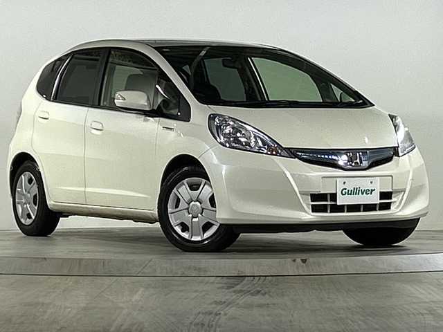 ホンダ フィット ハイブリット 広島県 2012(平24)年 1.9万km プレミアムホワイトパール 禁煙/純正ナビ（VXM-128VSXi）/・ワンセグ/CD/DVD/SD/クルーズコントロール/ＥＣＯＮ/ヘッドライトレベライザー/ＬＥＤドアミラーウインカー/オートエアコン/純正フロアマット