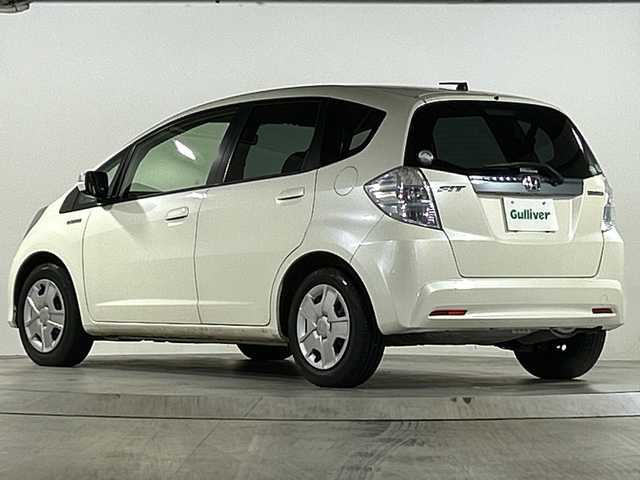 ホンダ フィット ハイブリット 広島県 2012(平24)年 1.9万km プレミアムホワイトパール 禁煙/純正ナビ（VXM-128VSXi）/・ワンセグ/CD/DVD/SD/クルーズコントロール/ＥＣＯＮ/ヘッドライトレベライザー/ＬＥＤドアミラーウインカー/オートエアコン/純正フロアマット