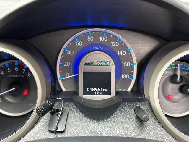 ホンダ フィット ハイブリット 広島県 2012(平24)年 1.9万km プレミアムホワイトパール 禁煙/純正ナビ（VXM-128VSXi）/・ワンセグ/CD/DVD/SD/クルーズコントロール/ＥＣＯＮ/ヘッドライトレベライザー/ＬＥＤドアミラーウインカー/オートエアコン/純正フロアマット