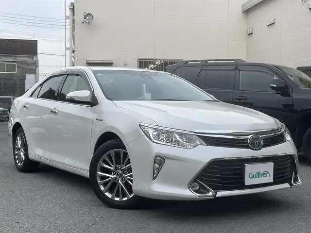 トヨタ カムリ ハイブリット Gパッケージ プレミアムブラック 和歌山県 2016(平28)年 10.4万km ホワイトパールクリスタルシャイン 純正ナビ/（AM/FM/CD/DVD/Bluetooth/フルセグTV）/ワンオーナー/ブラインドスポットモニター/クルーズコントロール（追従なし）/レーンキープアシスト/空気圧センサー/前方ドライブレコーダー（SDなし）/ビルトインETC/アイドリングストップ/D席パワーシート/ハーフレザーシート/取扱説明書/保証書