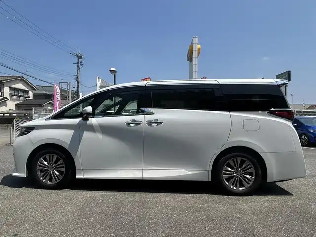 トヨタ アルファード Z 奈良県 2024(令6)年 0.7万km プラチナホワイトパールマイカ ワンオーナー/純正メーカナビ/ムーンルーフ/サイドエンブレム/置き充電/ベンチレーション/シートヒーター/サンシェード/デジタルインナーミラー/黒レザーシート/パワーシート/スペアキー/クルコン追従/メモリーシート/パワーバック/アラウンドビューカメラ/取扱説明書/保証書
