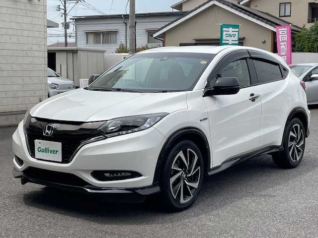 ホンダ ヴェゼル ハイブリッド RS ホンダセンシング 大分県 2017(平29)年 6.7万km ホワイトオーキッドパール 純正メモリーナビ/CD/DVD/BT/USB/HDMI/フルセグTV/バックカメラ/ハーフレザーシート/前席シートヒーター/ホンダセンシング/レーンキープ/レーダークルーズコントロール/ステアリングスイッチ/パドルシフト/オート電動格納ミラー/ドライブレコーダー/ビルトインETC/保証書/取扱説明書/スペアキー