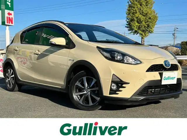 トヨタ アクア クロスオーバー グラム 愛知県 2019(平31)年 7.8万km ベージュ ワンオーナー/純正メモリナビ/フルセグテレビ/バックカメラ/Bluetooth/ウィンカーミラー/クルーズコントロール/ドアバイザー/プッシュスタート/ETC/衝突軽減ブレーキ/レーンキープ/ハーフレザーシート