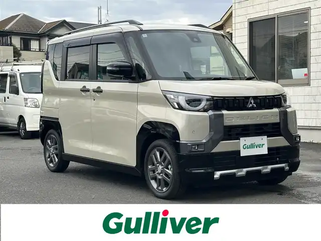 三菱 デリカミニ G プレミアム 東京都 2024(令6)年 0.5万km ナチュラルアイボリーメタリック プッシュスタート/オートパーキング/純正ナビ　/純正フロアマット/シートヒーター/ステアリングヒーター/クルーズコントロール/ステアリングリモコン/ミラーモニター/全方位バックミラー/両側電動スライドドア/電動トランクリッド/フルフラットシート/ルーフレール/説明書/保証書/スペアキー1本