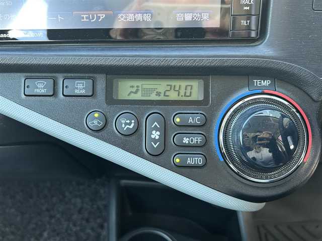 トヨタ アクア S 広島県 2014(平26)年 6.6万km ライムホワイトパールクリスタルシャイン 7インチナビ（フルセグTV/CD/DVD/iPod/USB/SD/VTR/AM/FM/HDMI）/バックカメラ/LEDヘッドライト/フォグランプ/ステアリングスイッチ/電動格納ミラー/ドアバイザー/ISOFIX/純正アルミ/スマートキー/スペアキー