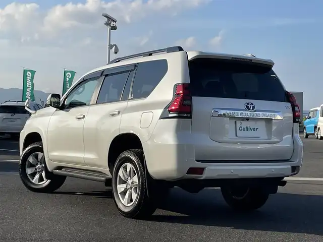 トヨタ ランドクルーザー プラド TX 島根県 2021(令3)年 3.1万km ホワイトパールクリスタルシャイン 登録時走行距離30823km/ワンオーナー/4WD/保証書/取扱説明書/純正SDナビ/・フルセグTV/・Bluetooth接続/・CD／DVD再生/・SDミュージックサーバー/・AM/FM/ToyotaSafetySenseP/・プリクラッシュセーフティ/・レーントレーシングアシスト/・レーンディパーチャーアラート/・オートマチックハイビーム /・ロードサインアシスト/・先行車発進アラーム/コーナーセンサー/サイドステップ/ルーフレール/ヘッドライトウォッシャー/3列シート/ビルトインETC/スマートキー/スペアキー