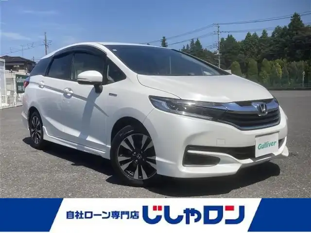 ホンダ シャトル ハイブリッド X 埼玉県 2015(平27)年 10.8万km ホワイトオーキッドパール (株)IDOMが運営する【じしゃロン鳩ヶ谷店】の自社ローン専用車両になりますこちらは現金またはオートローンご利用時の価格です。自社ローンご希望の方は別途その旨お申付け下さい/純正メモリナビ/純正フルセグテレビ/バックカメラ/クルーズコントロール/プッシュスタート/ビルトインETC/前後ドライブレコーダー/ハーフレザーシート/純正15インチAW/純正LEDヘッドライト