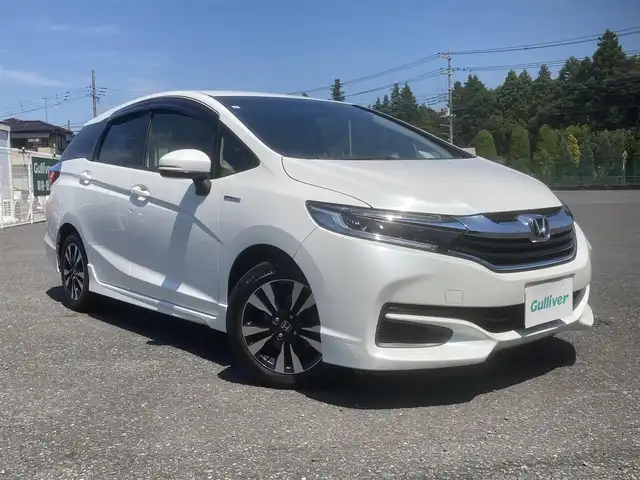 ホンダ シャトル ハイブリッド X 埼玉県 2015(平27)年 10.8万km ホワイトオーキッドパール (株)IDOMが運営する【じしゃロン鳩ヶ谷店】の自社ローン専用車両になりますこちらは現金またはオートローンご利用時の価格です。自社ローンご希望の方は別途その旨お申付け下さい/純正メモリナビ/純正フルセグテレビ/バックカメラ/クルーズコントロール/プッシュスタート/ビルトインETC/前後ドライブレコーダー/ハーフレザーシート/純正15インチAW/純正LEDヘッドライト