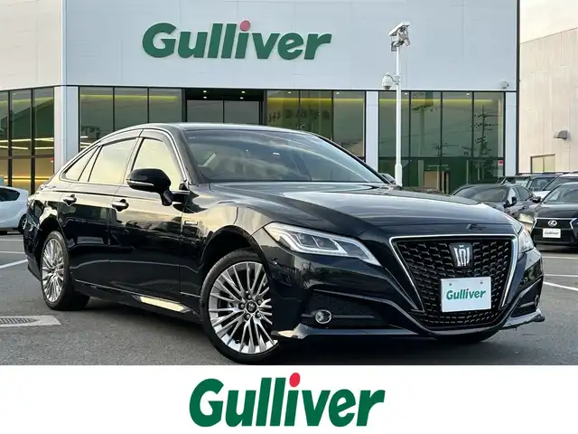 トヨタ クラウン ハイブリッド G 愛媛県 2019(令1)年 4.9万km プレシャスブラックパール 登録時走行距離：48169Km/純正メーカーOPメモリナビ/AM/FM/CD/DVD/TV/BT/SD/ETC2.0/Bカメラ/前後ドラレコ/パワーシート/追従クルコン/横滑り防止装置/盗難防止装置/衝突軽減システム/前後コーナーセンサー/LEDヘッドライト/オートライト/オートハイビーム/エンジンスタートボタン/スマートキー/純正アルミホイール/純正フロアマット
