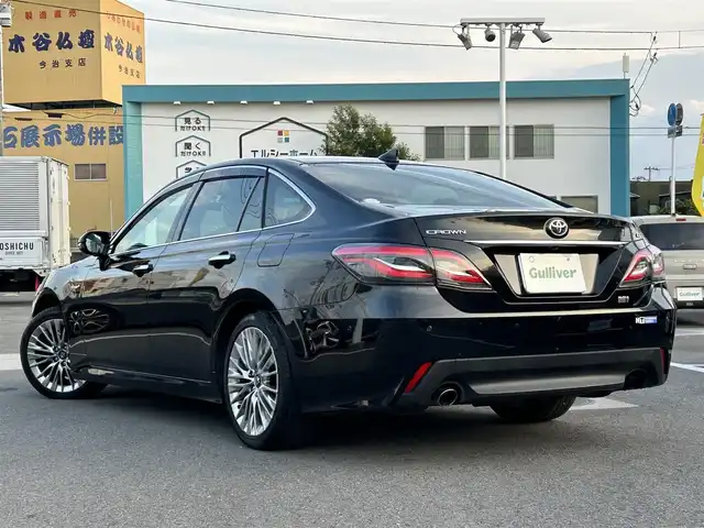 トヨタ クラウン ハイブリッド G 愛媛県 2019(令1)年 4.9万km プレシャスブラックパール 登録時走行距離：48169Km/純正メーカーOPメモリナビ/AM/FM/CD/DVD/TV/BT/SD/ETC2.0/Bカメラ/前後ドラレコ/パワーシート/追従クルコン/横滑り防止装置/盗難防止装置/衝突軽減システム/前後コーナーセンサー/LEDヘッドライト/オートライト/オートハイビーム/エンジンスタートボタン/スマートキー/純正アルミホイール/純正フロアマット
