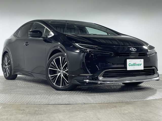 トヨタ プリウス Z 神奈川県 2024(令6)年 4.5万km アティチュードブラックマイカ トヨタセーフティセンス/純正12.3型ディスプレイオーディオ/・BT/フルセグTV/USB/MiraCast/パノラミックビューモニター/デジタルインナーミラー/AC100V/置くだけ充電/モデリスタエアロキット/ビルトインETC2.0/BSM/パーキングアシスト/パワーバックドア/電動サイドブレーキ/オートブレーキホールド/レザー調シート/パワーシート(D)/メモリシート(D)/シートヒーター(D/N)/ベンチレーション(D/N)/EVモード/ECO/SPORTモード/革巻きステアリング/ステアリングスイッチ/Autoライト/ステアリングヒーター/ヘッドライトレベライザー/LEDヘッドライト/電動格納ミラー/ウィンカーミラー/フロアマット/純正ドアバイザー/純正19インチアルミホイール