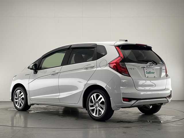 ホンダ フィット ハイブリット F 宮崎県 2018(平30)年 2.5万km プラチナホワイトパール 純正ナビ(VXM-194VFi)/CD/DVD/AM/FM/SD/BT/スマートキー　スペア１本/横滑り防止装置/アイドリングストップ/ステアリングスイッチ/電動格納ミラー/ウインカーミラー/社外アルミホイール/純正フロアマット/サイドバイザー/ETC