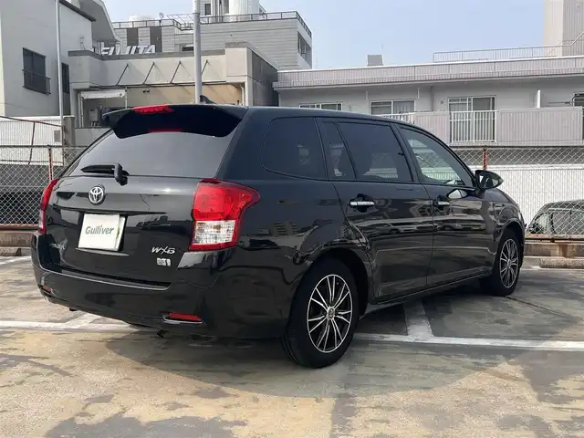 トヨタ カローラ フィールダー ハイブリッドG ダブルバイビー 広島県 2014(平26)年 8.6万km ブラックマイカ 　　　　　○走行距離：85804km（入庫時）/純正ナビ/・Bluetooth/・ワンセグTV/・DVD/セーフティセンスC（衝突回避支援パッケージ）/・プリクラッシュセーフティ/・レーンディバーチャーアラート/・オートマチックハイビーム/先行車発進告知機能/スマートエントリーシステム（スペアキーあり）/SRSエアバック（運転席/助手席/サイド/カーテン）/ビルトインETC/ドライブレコーダー/純正フロアマット/社外シートカバーつき/社外15インチアルミホイール/社外インナーミラー/保証書＆取扱説明書あり