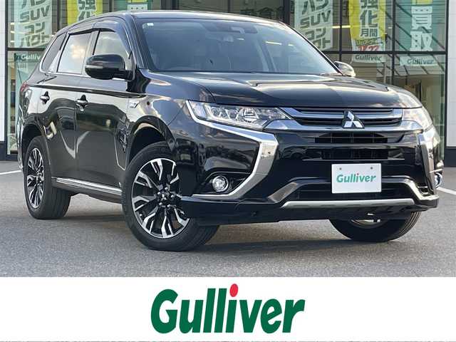 三菱 アウトランダー ＰＨＥＶ G セーフティパッケージ 岡山県 2017(平29)年 4.6万km ルビーブラックP 登録時走行距離45556km/4WD/社外ナビ/フルセグTV(AM/FM/CD/DVD/Bluetooth)/マルチアラウンドモニター/ETC/衝突軽減被害ブレーキシステム/車線逸脱警報システム/オートマチックハイビーム/レーダークルーズコントロール/横滑り防止装置/D/N席シートヒーター/ステアリングヒーター/電子パーキング/オートブレーキホールド/レザーシート/18インチ純正AW/フロアマット