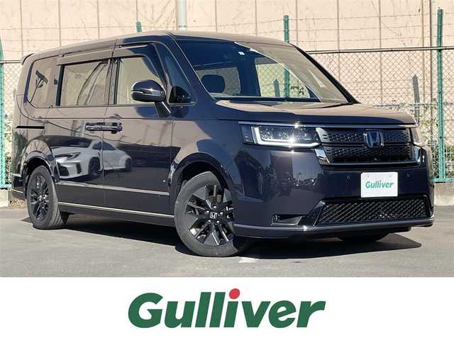 ホンダ ステップワゴン スパーダ eHEV 東京都 2023(令5)年 2万km パープルＭ 純正ナビ/電動パワーバックドア/全周囲カメラ/フルセグTV/前後ドライブレコーダー/両側電動スライドドア/ETC/オットマン/デジタルインナーミラー/パドルシフト/純正フロアマット/サイドバイザー/前席シートヒーター/前後コーナーセンサー/衝突軽減装置/横滑り防止装置/LEDライト/フォグライト