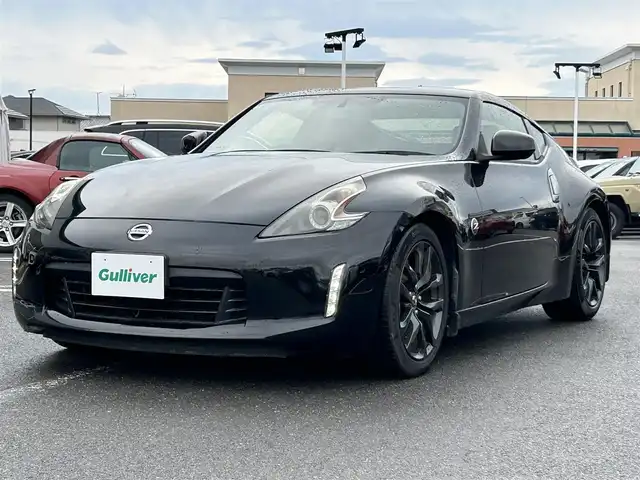 日産 フェアレディ Ｚ バージョンT 長崎県 2018(平30)年 5.7万km ダイヤモンドブラック 純正HDDナビ(BT/FM/AM/CD/ワンセグTV)/プッシュスタート/スマートキー/オートエアコン/バックカメラ/純正フロアマット/純正18インチアルミホイール/スエード調コンビシート/ABS/横滑り防止装置/オートライト/SRSダブル・サイドエアバッグ/SRSカーテンエアバッグ
