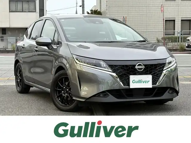 日産 ノート X 三重県 2023(令5)年 1.6万km ダークメタルグレー ♪走行16005km/♪車検 令和8年9月13日迄/エマージェンシーブレーキ/インテリジェントLI/インテリジェントBSI/コーナーセンサー/インテリキー×2/プッシュスタート/オートブレーキホールド/デジタルインナーミラー/純正9インチナビ/・SD・フルセグ/・Bluetoothオーディオ/・アラウンドビューモニター/・バックカメラ/USBポート(充電)/ドライブレコーダー/社外16インチAW/LEDヘッドライト/LEDフォグライト/オートライト/オートハイビーム/ウィンカーミラー/オートリトラクタブルミラー/ステアリングスイッチ/プライバシーガラス/フロアマット/ETC2.0/サイド/カーテン/ニーエアバック