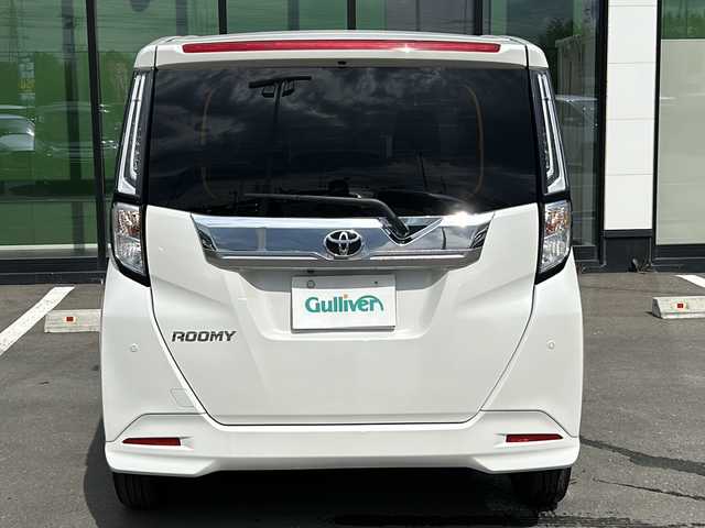 トヨタ ルーミー カスタムG 青森県 2023(令5)年 1.2万km パールホワイトⅢ ・寒冷地仕様/・４WD/・社外9インチメモリナビ/　（AM　FM　CD　DVD　TV　BT　SD）/・バックカメラ/・スマートキー/・プッシュスタート/・レーダークルーズコントロール/・純正エンジンスターター/・アイドリングストップ/・スマートアシスト/・先行車発進通知/・衝突警報/・車線逸脱警報/・ふらつき警報/・社外前後型ドライブレーコーダー/・プッシュスタート/・純正アルミホイール/・フロントフォグ/・ドアバイザー/・保証書/・取扱説明書