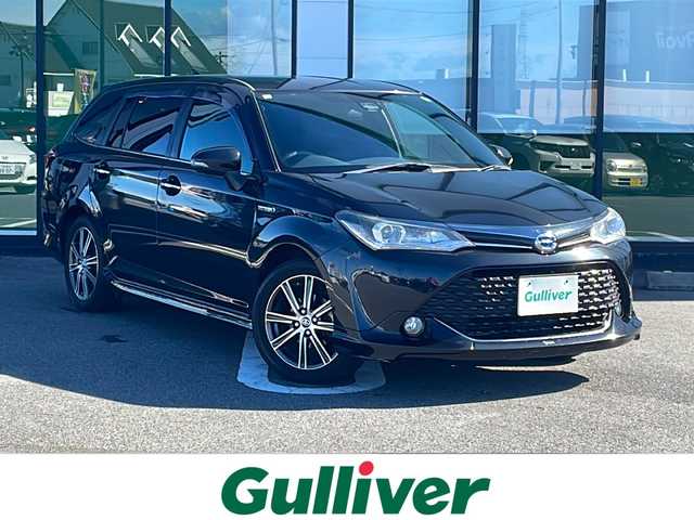 トヨタ カローラ フィールダー ハイブリッドG ダブルバイビー 岐阜県 2015(平27)年 17.6万km ブラックマイカ 登録時走行距離：175283km/ナビ（MDV-L502W）/フルセグテレビ・Bluetooth/モデリスタエアロ/レーンキープアシスト/ETC/衝突被害軽減システム/LEDヘッドライト/オートライト/オートマチックハイビーム/フォグライト/純正16インチアルミホイール/純正フロアマット/ドアバイザー/プッシュスタート/スマートキー/保証書