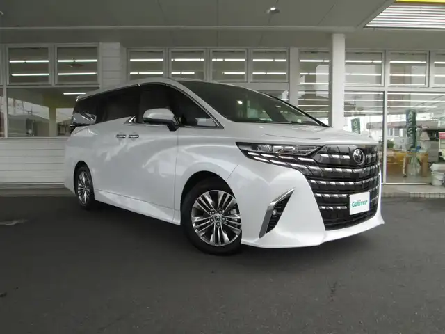 トヨタ アルファードハイブリット Z 千葉県 2024(令6)年 0.2万km プラチナホワイトパールマイカ ワンオーナー/4WD/トヨタセーフティセンス/純正ディスプレイオーディオ(コネクティッドナビ対応)Plus/パノラミックビューモニター(床下透過表示機能付)/純正オーディオ【フルセグTV/BT/USB】/トヨタチームメイト【アドバンストドライブ(渋滞時支援)】/左右独立ムーンルーフ/デジタルインナーミラー/カラーヘッドアップディスプレイ/スペアタイヤ/純正13.2型有機EL後席フリップダウンモニター/LEDヘッドライト&LEDフォグランプ/レーダークルーズコントロール/レーンキープアシスト/BSM/パドルシフト付きウッドコンビステアリング/パワーバックドア/運転席シートメモリ/ステアリングヒーター/1&2列目(シートヒーター/エアシート/パワーシート)/TZ360°ドライブレコーダー/ビルトインETC2.0/純正フロアマット/純正ドアバイザー/取扱説明書/新車時保証書/スペアキー/R7トヨタ整備記録簿