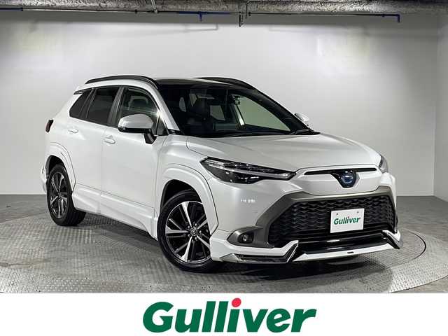 トヨタ カローラ クロス ハイブリッド Z 沖縄県 2022(令4)年 2.3万km プラチナホワイトパールマイカ 県外仕入　/禁煙車　/純正９インチディスプレイオーディオ　/バックカメラ/モデリスタエアロ　/パノラマルーフ　/パワーバックドア　/レーダークルーズコントロール　/ブラインドスポットモニター　/オートハイビーム　/パワーシート　/シートヒーター/ステアリングリモコン/オートブレーキホールド