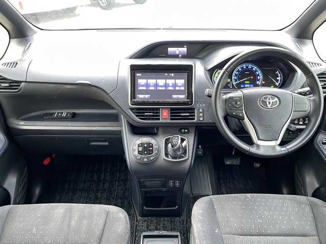 トヨタ ノア ハイブリッド G 沖縄県 2015(平27)年 18.5万km ボルドーマイカメタリック 純正ナビ・TV・Bluetooth・CD/DVD/バックカメラ/フリップダウンモニター/両側パワースライドドア/ETC/オートライト/LEDヘッドライト/シートヒーター/セーフティセンスC