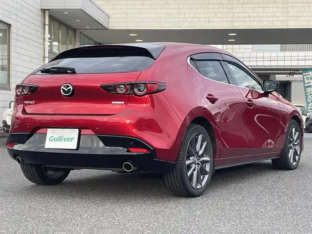 マツダ マツダ３ファストバック 20S プロアクティブ ツーリングS 広島県 2021(令3)年 7.6万km ソウルレッドクリスタルM ワンオーナー/メーカーオプションナビ/　（フルセグテレビ/Bluetooth/CD/DVD/AM/FM）/BOSEプレミアムサウンド/レーダークルーズコントロール/ETC/ドライブレコーダー/USB入力端子/HDMI/純正18インチアルミホイール/コーナーセンサー/メモリシート/アイドリングストップ/パワーシート/シートヒーター/ステアリングヒーター/LEDヘッドライト/パドルシフト/横滑り防止装置/衝突被害軽減システム/盗難防止装置/W＋サイドエアバック/カーテンエアバック/オートライト/スペアキー/保証書/取扱説明書