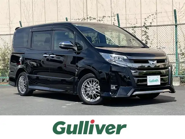 トヨタ ノア ハイブリッド Si ダブルバイビーⅢ 東京都 2020(令2)年 6.2万km ブラック 社外9インチナビ（アルパインBIGX）/Bluetooth/フルセグテレビ/CD/DVD/USB入力端子/12.8インチアルパインフリップダウンモニター（RXH12X-L）/ETC/バックカメラ/ドライブレコーダー（ZDR０２５）/社外フロアマット/ハーフレザー/両側パワースライドドア/純正16インチアルミホイール/前後コーナーセンサー/純正LEDヘッドライト/オートライト/スマートキー/クルーズコントロール/純正サイドバイザー/後席テーブル/後席USB