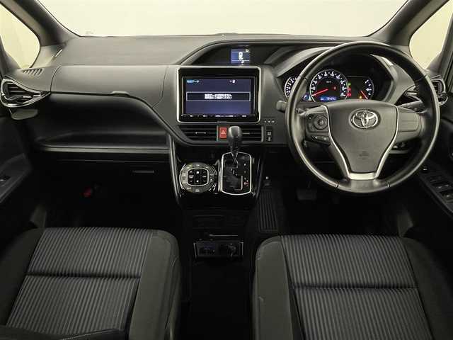 トヨタ ヴォクシー ZS 煌Ⅱ 福岡県 2016(平28)年 7.3万km ブラック 後席モニター　/純正９型ナビ（ＢＴ，フルセグＴＶ）　/バックカメラ　/前後ドラレコ　/ビルトインＥＴＣ　/衝突被害軽減ブレーキ　/レーンキープ　/アイドリングストップ　/ＭＴモード付き　/両側電動スライドドア　/ＬＥＤ