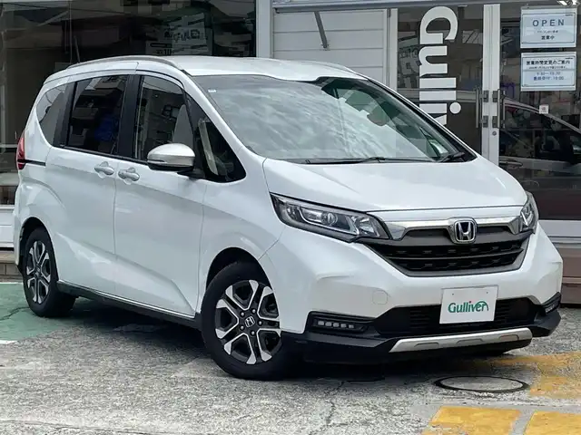 ホンダ フリード クロスター ホンダセンシング 神奈川県 2020(令2)年 1.8万km プラチナホワイトパール ワンオーナー/純正メモリナビ/　（CD・DVD・Bluetooth）/フルセグTV/純正フリップダウンモニター/両側パワースライドドア/ホンダセンシング/アダプティブクルーズコントロール/バックカメラ/ビルトインETC/LEDヘッドライト/LEDフォグライト/ハーフレザーシート/スマートキー/純正15インチAW/保証書/取扱説明書