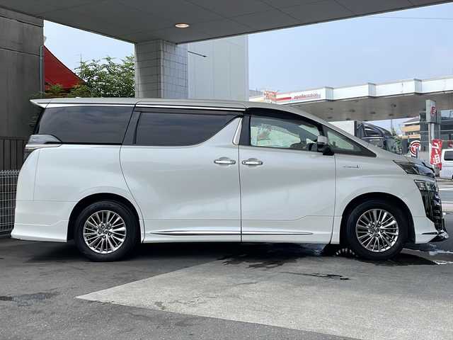 トヨタ ヴェルファイア ハイブリット ZR Gエディション 京都府 2018(平30)年 9万km ホワイトパールクリスタルシャイン ＪＢＬメーカーナビ/AM/FM/AUX/HDMI/USB/Bluetooth/フルセグＴＶ/（キャンセラー付き）/全方位モニター/サンルーフ/純正フリップダウンモニター/モデリスタフルエアロ/　（マフラーカッター）/三眼ＬＥＤヘッドライト/レーダークルーズコントロール/両側パワースライドドア/電動リアゲート/トヨタセーフティーセンス/LEDシグネチャーイルミブレード/デジタルミラー/ブラインドスポットモニター/メモリー付きパワーシート/デュアルエアコン/レザーシート/前席ベンチレーション/前席シートヒーター/ステアリングヒーター/ビルトイン2.0ETC/前方ドライブレコーダー/盗難防止装置/（社外セキュリティ）/100V電源/プッシュスタート/スマートキー/3列シート/オットマン/ウォークスルー/レーンキープアシスト/横滑り防止装置/前後コーナーセンサー/オートマチックハイビーム/AFS/（アダクティブフロントライティングシステム）/ダブルエアバッグ+サイドエアバッグ/フォグライト