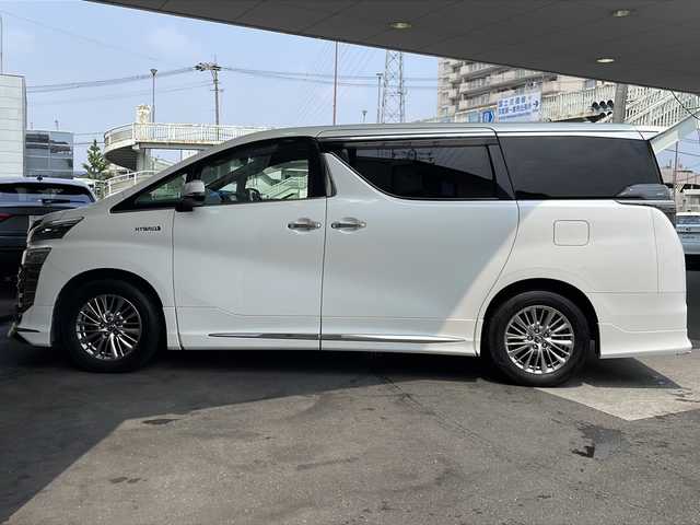 トヨタ ヴェルファイア ハイブリット ZR Gエディション 京都府 2018(平30)年 9万km ホワイトパールクリスタルシャイン ＪＢＬメーカーナビ/AM/FM/AUX/HDMI/USB/Bluetooth/フルセグＴＶ/（キャンセラー付き）/全方位モニター/サンルーフ/純正フリップダウンモニター/モデリスタフルエアロ/　（マフラーカッター）/三眼ＬＥＤヘッドライト/レーダークルーズコントロール/両側パワースライドドア/電動リアゲート/トヨタセーフティーセンス/LEDシグネチャーイルミブレード/デジタルミラー/ブラインドスポットモニター/メモリー付きパワーシート/デュアルエアコン/レザーシート/前席ベンチレーション/前席シートヒーター/ステアリングヒーター/ビルトイン2.0ETC/前方ドライブレコーダー/盗難防止装置/（社外セキュリティ）/100V電源/プッシュスタート/スマートキー/3列シート/オットマン/ウォークスルー/レーンキープアシスト/横滑り防止装置/前後コーナーセンサー/オートマチックハイビーム/AFS/（アダクティブフロントライティングシステム）/ダブルエアバッグ+サイドエアバッグ/フォグライト