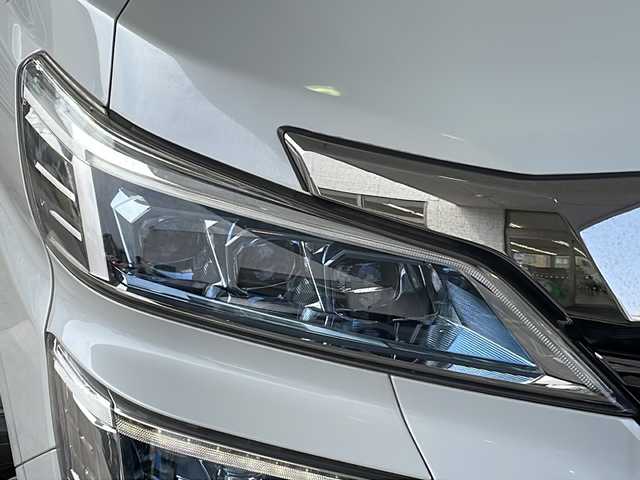 トヨタ ヴェルファイア ハイブリット ZR Gエディション 京都府 2018(平30)年 9万km ホワイトパールクリスタルシャイン ＪＢＬメーカーナビ/AM/FM/AUX/HDMI/USB/Bluetooth/フルセグＴＶ/（キャンセラー付き）/全方位モニター/サンルーフ/純正フリップダウンモニター/モデリスタフルエアロ/　（マフラーカッター）/三眼ＬＥＤヘッドライト/レーダークルーズコントロール/両側パワースライドドア/電動リアゲート/トヨタセーフティーセンス/LEDシグネチャーイルミブレード/デジタルミラー/ブラインドスポットモニター/メモリー付きパワーシート/デュアルエアコン/レザーシート/前席ベンチレーション/前席シートヒーター/ステアリングヒーター/ビルトイン2.0ETC/前方ドライブレコーダー/盗難防止装置/（社外セキュリティ）/100V電源/プッシュスタート/スマートキー/3列シート/オットマン/ウォークスルー/レーンキープアシスト/横滑り防止装置/前後コーナーセンサー/オートマチックハイビーム/AFS/（アダクティブフロントライティングシステム）/ダブルエアバッグ+サイドエアバッグ/フォグライト