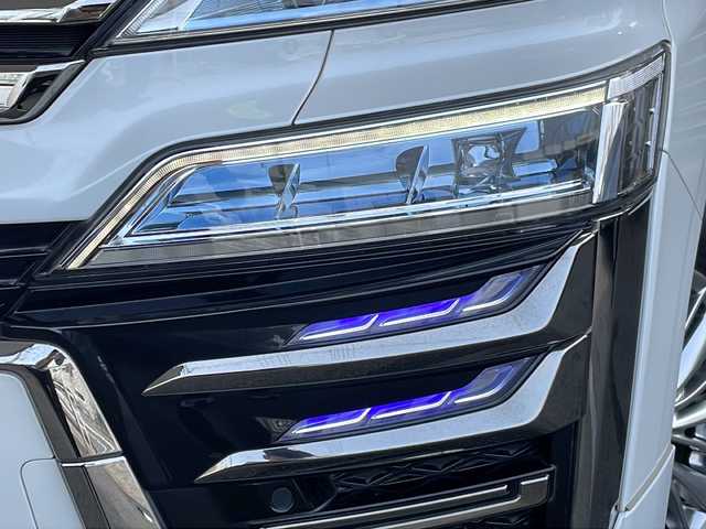 トヨタ ヴェルファイア ハイブリット ZR Gエディション 京都府 2018(平30)年 9万km ホワイトパールクリスタルシャイン ＪＢＬメーカーナビ/AM/FM/AUX/HDMI/USB/Bluetooth/フルセグＴＶ/（キャンセラー付き）/全方位モニター/サンルーフ/純正フリップダウンモニター/モデリスタフルエアロ/　（マフラーカッター）/三眼ＬＥＤヘッドライト/レーダークルーズコントロール/両側パワースライドドア/電動リアゲート/トヨタセーフティーセンス/LEDシグネチャーイルミブレード/デジタルミラー/ブラインドスポットモニター/メモリー付きパワーシート/デュアルエアコン/レザーシート/前席ベンチレーション/前席シートヒーター/ステアリングヒーター/ビルトイン2.0ETC/前方ドライブレコーダー/盗難防止装置/（社外セキュリティ）/100V電源/プッシュスタート/スマートキー/3列シート/オットマン/ウォークスルー/レーンキープアシスト/横滑り防止装置/前後コーナーセンサー/オートマチックハイビーム/AFS/（アダクティブフロントライティングシステム）/ダブルエアバッグ+サイドエアバッグ/フォグライト