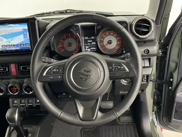 スズキ ジムニー シエラ JC 鹿児島県 2024(令6)年 1.5万km ジャングルグリーン 社外SDナビ/（AM/FM/CD/DVD/Bluetooth)/フルセグテレビ/バックカメラ/衝突軽減ブレーキ/クルーズコントロール/前席シートヒーター/ＥＴＣ/4WD/前後ドライブレコーダー/ＬＥＤヘッドライト/ヘッドライトウォッシャー/オートライト/アイドリングストップ/スマートキー/純正フロアマット