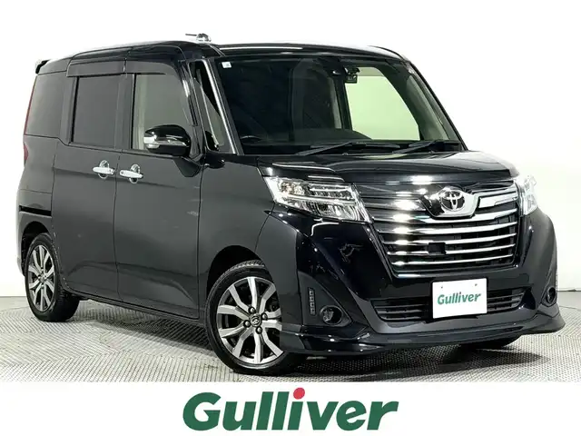 トヨタ ルーミー カスタムG－T 大阪府 2018(平30)年 2.6万km ブラックマイカメタリック ALPINE9incナビTV バックカメラ フリップダウンモニター 両側パワースライドドア シートヒーター クルーズコントロール 衝突軽減ブレーキ レーンアシスト スマートキー プッシュスタート ドライブレコーダー ETC