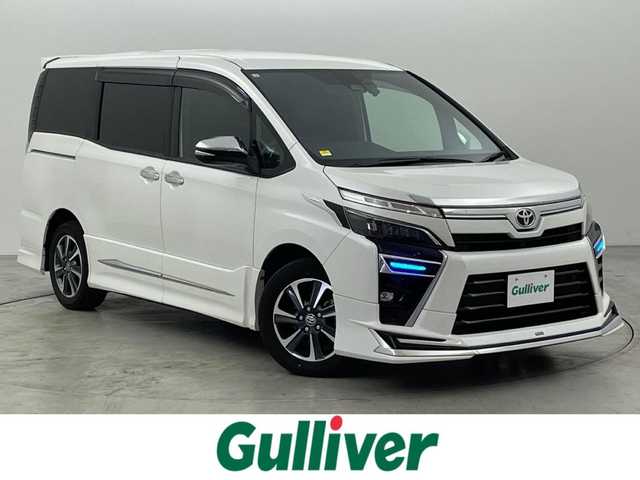 トヨタ ヴォクシー ZS 煌Ⅱ 福岡県 2020(令2)年 6.5万km ホワイトパールクリスタルシャイン モデリスタエアロ　/フリップダウンモニター　/純正１０型ナビ　/バックカメラ　/ビルトインＥＴＣ　/３６０°ドラレコ　/クルーズコントロール　/コーナーセンサー/衝突被害軽減ブレーキ　/レーンキープ　/ＰＫＳＢ　/ＭＴモード付き　/両側電動スライドドア