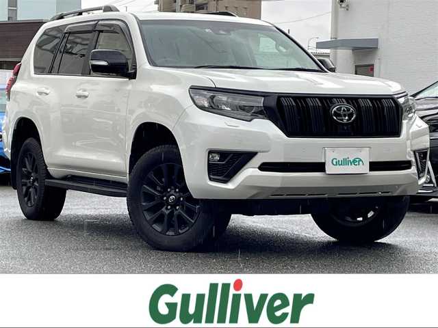 トヨタ ランドクルーザー プラド TX Lパッケージ マットブラED 福岡県 2022(令4)年 3万km ホワイトパールクリスタルシャイン 純正ディーラーナビ/（Bluetooth対応/フルセグ/AM/FM）/サンルーフ/前席シートヒーター/前席パワーシート/クルーズコントロール/アラウンドビューモニター/ブラインドスポットモニター/ETC/プッシュスタート/3列シート/3列目パワーシート/クリアランスソナー/純正フロアマット/純正アルミホイール/ルーフレール/ドアバイザー/禁煙車/保証書/取扱説明書