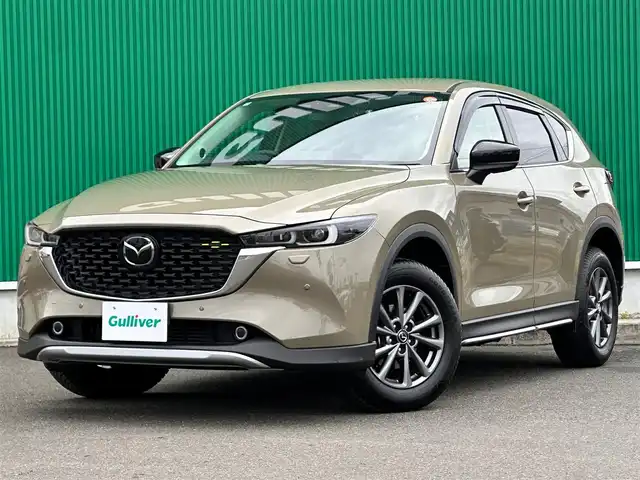 マツダ ＣＸ－５ XD フィールドジャーニー 宮城県 2022(令4)年 1.3万km ジルコンサンドメタリック BOSEサウンドシステム/ハンズフリーパワーバックドア/クルージングトラフィックサポート/ワイヤレス充電/10.25インチセンターディスプレイ/地デジTVチューナー/＝＝＝/オフロードトラクションアシスト/インテリジェントドライブセレクト（オフロード）/アドバンストスマートシティブレーキサポート/後退時スマートシティブレーキサポート/誤発進抑制制御/スマートブレーキサポート/レーダークルーズコントロール/ブラインドスポットモニタリング/車線逸脱警報システム/レーンキープアシストシステム/パーキングセンサー/ドライバーアテンションアラート/ヘッドアップディスプレイ/360度ビューモニター/ハーフレザーシート/運転席メモリー機能付パワーシート/シートヒーター/ステアリングヒーター/革巻きステアリング/パドルシフト/アダプティブLEDヘッドランプ/フォグランプ/オートライト/電動パーキングブレーキ/ブレーキホールド/ルーフレール/純正17インチAW/フロアマット/ドアバイザー
