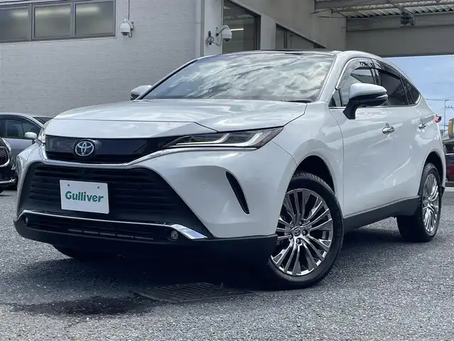 トヨタ ハリアー ハイブリッド Z 福岡県 2024(令6)年 0.3万km プラチナホワイトパールマイカ ワンオーナー/パノラマルーフ/純正12.3インチディスプレイナビ/・（USB/BT/Miracast/フルセグTV)/・JBLサウンドシステム/・全方位モニター/トヨタセーフティセンス/コーナーセンサー/デジタルインナーミラー/HUD/ETC2.0/純正ドライブレコーダー/パワーバックドア/ハーフレザーシート/・パワーシート（D）/プッシュスタート/・スマートキー/電子パーキング/・オートホールド/革巻きステアリング/・チルト＆テレストコピック/・ステアリングリモコン/LEDヘッドライト/・オートライト/・フォグライト/トノカバー/スペアタイヤ/純正フロアマット/ドアバイザー