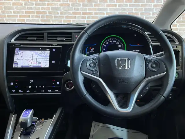 ホンダ シャトル ハイブリッド Z 岩手県 2015(平27)年 4万km ミスティックガーネットP ４WD/あんしんパッケージ/低速域衝突軽減ブレーキ/誤発進抑制機能/横滑り防止装置/チップアップリヤシート/シートヒーター/熱線入りフロントウインドウ/ヒーテッドドアミラー/パドルシフト/本革巻きステアリング/振幅感応式ダンパー/純正ナビ/（CD/DVD/フルセグ/USB/HDMI/Bluetooth）/ステアリングスイッチ/バックカメラ/ETC/LEDヘッドライト/フォグランプ/純正16インチアルミホイール