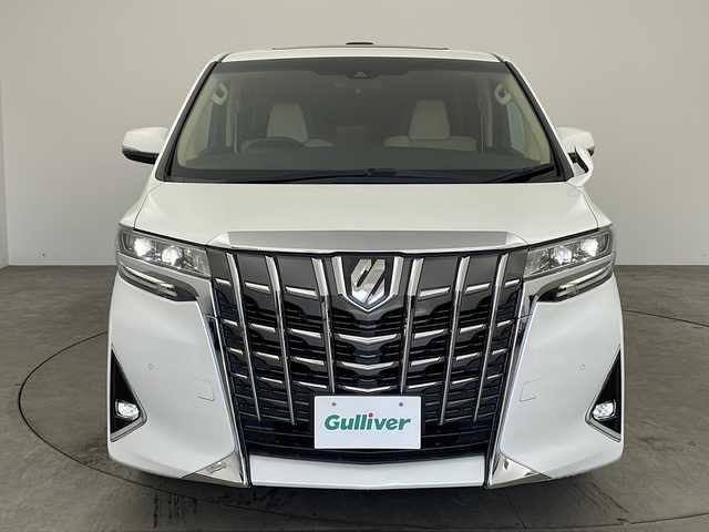トヨタ アルファード X 兵庫県 2018(平30)年 6.2万km ホワイトパールクリスタルシャイン ・純正ナビ/Bluetooth/CD/DVD/TV/SD/・フリップダウンモニター/・バックカメラ/・トヨタセーフティセンス/・衝突軽減ブレーキ/・レーンキープアシスト/・レーダークルーズコントロール/・電動パーキングブレーキ/・ブレーキホールド/・クリアランスソナー/・前後コーナーセンサー/・MTモード付AT/・両側パワースライドドア/・サンルーフ/・AC100V電源/・WAC/・純正16インチアルミホイール/・純正スマートキー/・プッシュスタートボタン/・スペアキー/・ステアリングリモコン/・革巻きステアリング/・W＋サイドエアバッグ/・カーテンエアバッグ/・LEDオートライト/・オートマチックハイビーム/・ビルドインETC