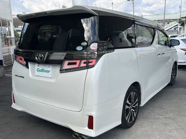 トヨタ ヴェルファイア Z Gエディション 京都府 2018(平30)年 10.3万km ホワイトパールクリスタルシャイン 10インチ純正SDナビ（NSZT-Z66T)/フルセグTV/Bluetooth/CD/DVD/USB/バックカメラ/12.8インチフリップダウンモニター/レーダクルーズコントロール/電動リアゲート/3眼LEDヘッドライト/デジタルインナーミラー/ステアリングヒーター/両側パワースライドドア/ビルトインETC/全方位ドライブレコーダ/シートヒーター/ベンチレーター/メモリー付きパワーシート/純正フロアマット/禁煙車