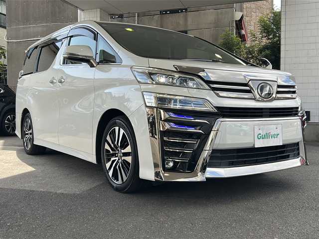 トヨタ ヴェルファイア Z Gエディション 京都府 2018(平30)年 10.3万km ホワイトパールクリスタルシャイン 10インチ純正SDナビ（NSZT-Z66T)/フルセグTV/Bluetooth/CD/DVD/USB/バックカメラ/12.8インチフリップダウンモニター/レーダクルーズコントロール/電動リアゲート/3眼LEDヘッドライト/デジタルインナーミラー/ステアリングヒーター/両側パワースライドドア/ビルトインETC/全方位ドライブレコーダ/シートヒーター/ベンチレーター/メモリー付きパワーシート/純正フロアマット/禁煙車