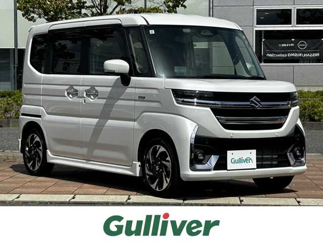 スズキ スペーシア カスタム HYBRID XS ターボ 福島県 2024(令6)年 0.7万km ピュアホワイトP スズキセーフティサポート/デュアルセンサーブレーキサポートII/アダプティブクルーズコントロール/車線維持支援機能/車線逸脱抑制機能/車線逸脱警報機能/ふらつき警報機能/標識認識機能/ハイビームアシスト/発進お知らせ機能/ヘッドアップディスプレイ/誤発進抑制機能/後方誤発進抑制機能/純正ナビゲーション/型番：CN-HZ885/【CD/DVD/SD/USB/BT/TV】/バックカメラ/ビルトインETC2.0/両側電動スライドドア/前席シートヒーター/ステアリングヒーター/ステアリングリモコン/パドルシフト/アイドリングストップ/リアサーキュレーター/シートバックテーブル/リアドアロールサンシェード/LEDオートライト/LEDフォグランプ/純正フロアマット/純正ドアバイザー