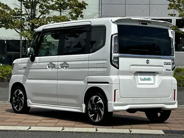 スズキ スペーシア カスタム HYBRID XS ターボ 福島県 2024(令6)年 0.7万km ピュアホワイトP スズキセーフティサポート/デュアルセンサーブレーキサポートII/アダプティブクルーズコントロール/車線維持支援機能/車線逸脱抑制機能/車線逸脱警報機能/ふらつき警報機能/標識認識機能/ハイビームアシスト/発進お知らせ機能/ヘッドアップディスプレイ/誤発進抑制機能/後方誤発進抑制機能/純正ナビゲーション/型番：CN-HZ885/【CD/DVD/SD/USB/BT/TV】/バックカメラ/ビルトインETC2.0/両側電動スライドドア/前席シートヒーター/ステアリングヒーター/ステアリングリモコン/パドルシフト/アイドリングストップ/リアサーキュレーター/シートバックテーブル/リアドアロールサンシェード/LEDオートライト/LEDフォグランプ/純正フロアマット/純正ドアバイザー