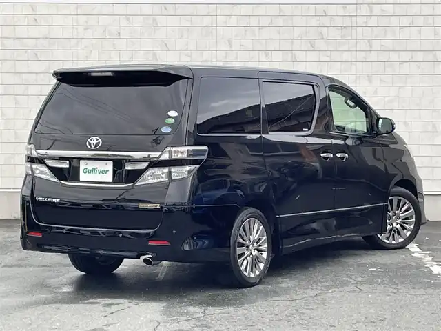 トヨタ ヴェルファイア 2．4Z ゴールデンアイズⅡ 愛知県 2014(平26)年 4.4万km ブラック 純正HDDナビ/バックカメラ/フルセグTV/CD/DVD再生/ETC/ミュージックサーバー(HDD録音)/Bluetooth接続/クルーズコントロール/MTモード付AT/3列シート/ハーフレザーシート/両側パワースライドドア/純正フロアマット/ウォークスルー(2列目)/オットマン(2列目)/純正18インチアルミホイール/オートライト/コーナーセンサー/横滑り防止装置/全席オートエアコン/ルーフカラーイルミネーション/スマートキー/プッシュスタート